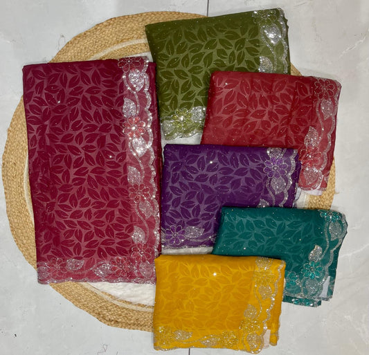 KAS-ZERO STAR GEORGETTE WITH EMBOSS PRINT WITH SIROSKI LEAF BORDER WITH SIROSKI RAIN ALL OVER