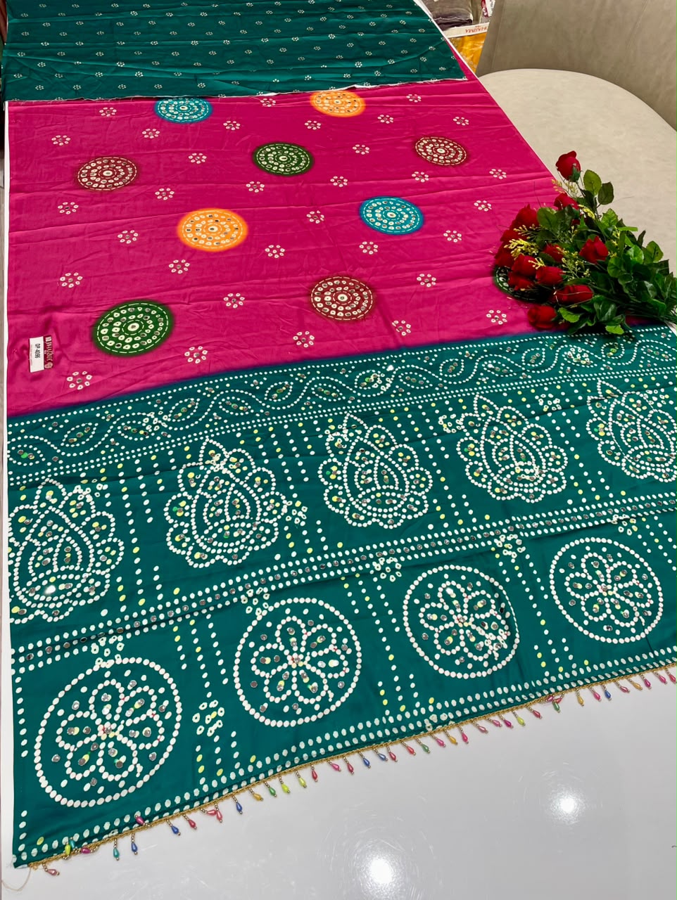DP-4096 JAPAN SATIN FABRIC SAREE WITH BEAUTIFUL DESIGN WITH HEAVY MIRROR WORK ON SAREE WITH BANDHANI DESIGN WITH HEAVY TASSELS WITH BLOUSE