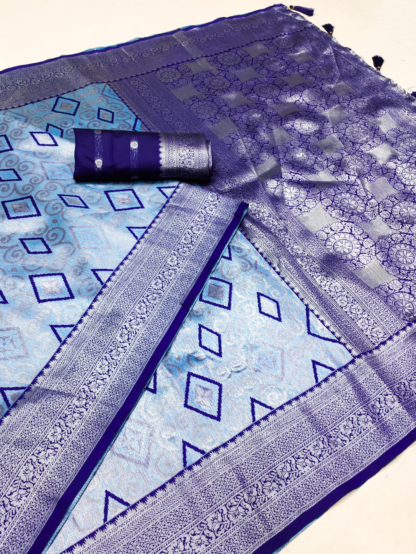 AJ-GEETANJALI PREMIUM SILVER PATTU SAREE WITH BEAUTIFUL BATIK PRINT ON BODY WITH SILVER JAREE BORDER WITH RICH PALLU AND TASSELS ATTACHED ON IT