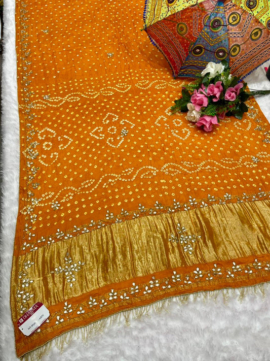 HT-PURE-AARTI PURE BANDHANI SAREE WITH JAIPURI WORK AND VIRAL BANDHANI DESIGN WITH PETHA WORK AND LAGNI PATTA WORK WITH KHATLI WORK AND GOLDEN PIPING WITH UNIQUE LUXURIOUS TASSELS