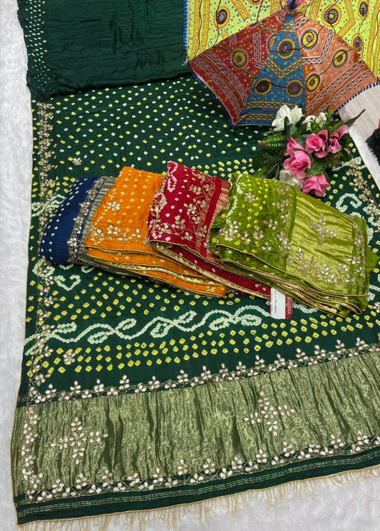 HT-PURE-AARTI PURE BANDHANI SAREE WITH JAIPURI WORK AND VIRAL BANDHANI DESIGN WITH PETHA WORK AND LAGNI PATTA WORK WITH KHATLI WORK AND GOLDEN PIPING WITH UNIQUE LUXURIOUS TASSELS