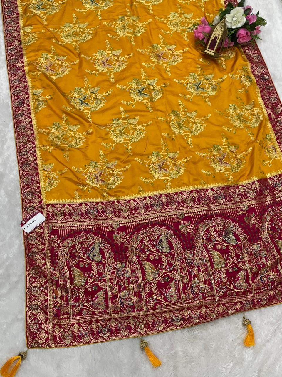 AJ-TITALI  SATIN SILK WITH BEAUTFUL PALLU WITH HEAVY DESIGN WITH JARKAN WORK WITH BEAUTIFUL BUTTERFLY DESIGN ON BODY AND PALLU WITH MEENAKARI WORK AND LUXURIOUS TASSELS WITH CONTRAST BUTTI BLOUSE