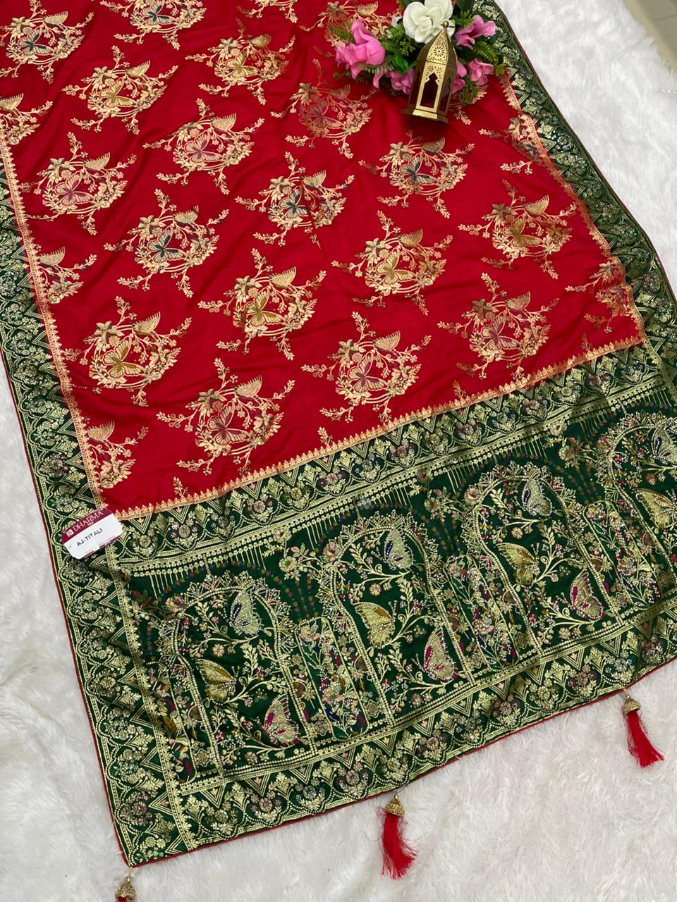 AJ-TITALI  SATIN SILK WITH BEAUTFUL PALLU WITH HEAVY DESIGN WITH JARKAN WORK WITH BEAUTIFUL BUTTERFLY DESIGN ON BODY AND PALLU WITH MEENAKARI WORK AND LUXURIOUS TASSELS WITH CONTRAST BUTTI BLOUSE