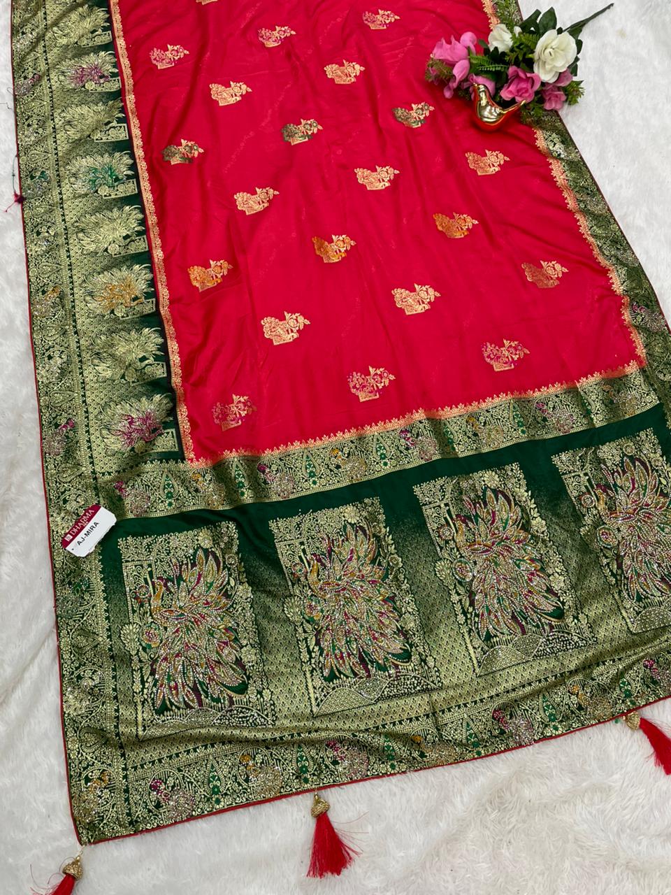 AJ-MIRA SATIN SILK WITH BEAUTFUL GRAND PALLU WITH HEAVY DESIGN WITH JARKAN WORK WITH MEENAKARI WORK AND LUXURIOUS TASSELS WITH CONTRAST BUTTI BLOUSE