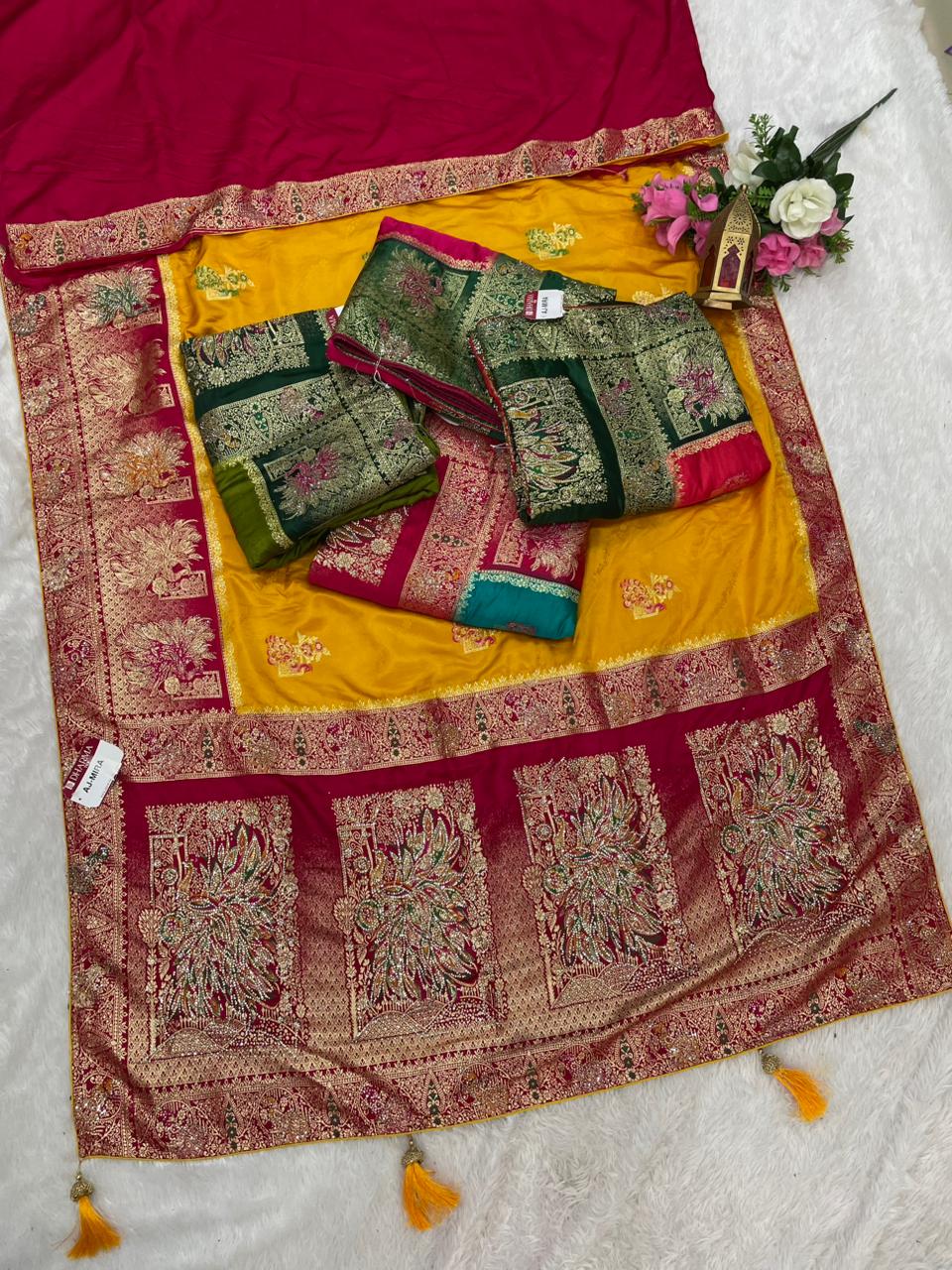 AJ-MIRA SATIN SILK WITH BEAUTFUL GRAND PALLU WITH HEAVY DESIGN WITH JARKAN WORK WITH MEENAKARI WORK AND LUXURIOUS TASSELS WITH CONTRAST BUTTI BLOUSE