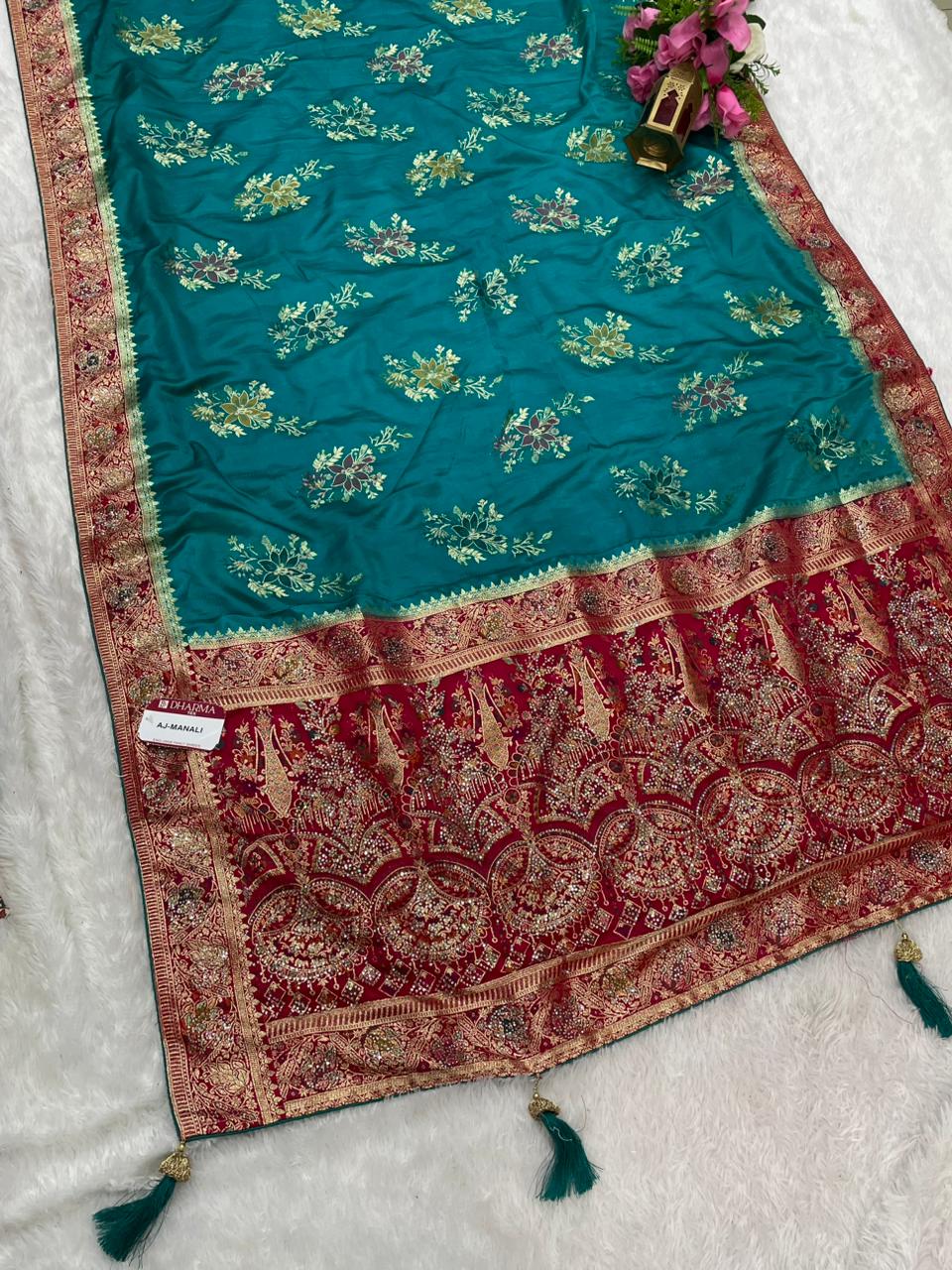 AJ-MANALI SATIN SILK WITH BEAUTFUL PALLU WITH HEAVY DESIGN WITH HEAVY JARKAN WORK WITH MEENAKARI WORK AND LUXURIOUS TASSELS WITH CONTRAST BUTTI BLOUSE