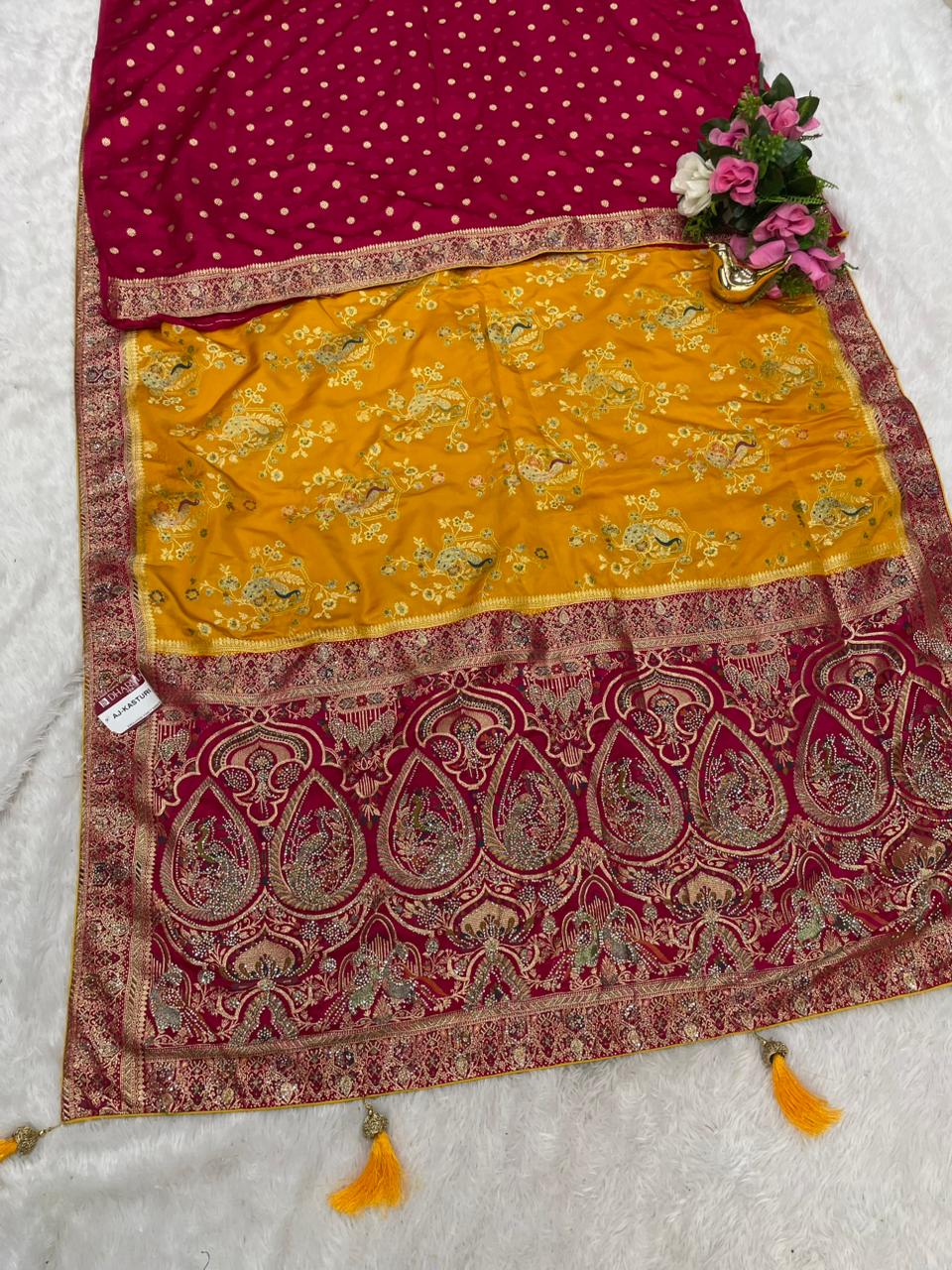 AJ-KASTURI  SATIN SILK WITH BEAUTFUL PALLU WITH HEAVY DESIGN WITH JARKAN WORK WITH MEENAKARI WORK AND LUXURIOUS TASSELS WITH CONTRAST BUTTI BLOUSE