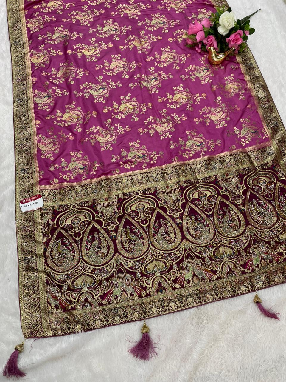 AJ-KASTURI  SATIN SILK WITH BEAUTFUL PALLU WITH HEAVY DESIGN WITH JARKAN WORK WITH MEENAKARI WORK AND LUXURIOUS TASSELS WITH CONTRAST BUTTI BLOUSE