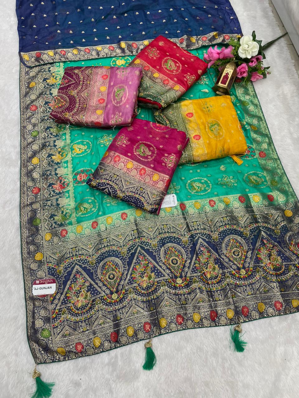 AJ-GUNJAN FENDI SILK FABRIC SAREE WITH 2D DYING WORK WITH MEENAKARI WORK AND DIAMOND WORK WITH PEACOCK FIGURE DESIGN WITH CONTRAST BLOUSE AND PALLU WITH LUXURIOUS TASSELS WITH BUTTI BLOUSE