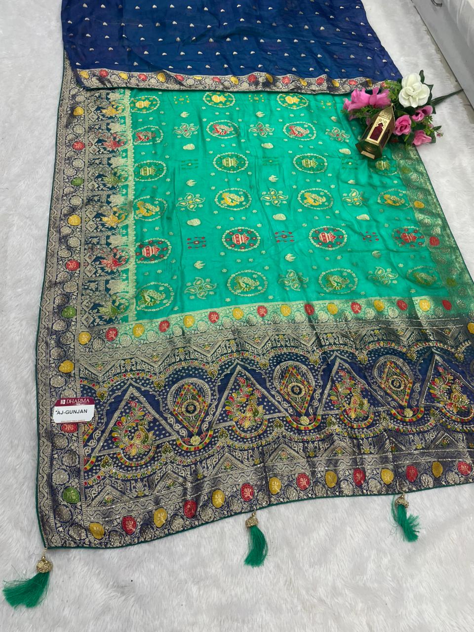 AJ-GUNJAN FENDI SILK FABRIC SAREE WITH 2D DYING WORK WITH MEENAKARI WORK AND DIAMOND WORK WITH PEACOCK FIGURE DESIGN WITH CONTRAST BLOUSE AND PALLU WITH LUXURIOUS TASSELS WITH BUTTI BLOUSE