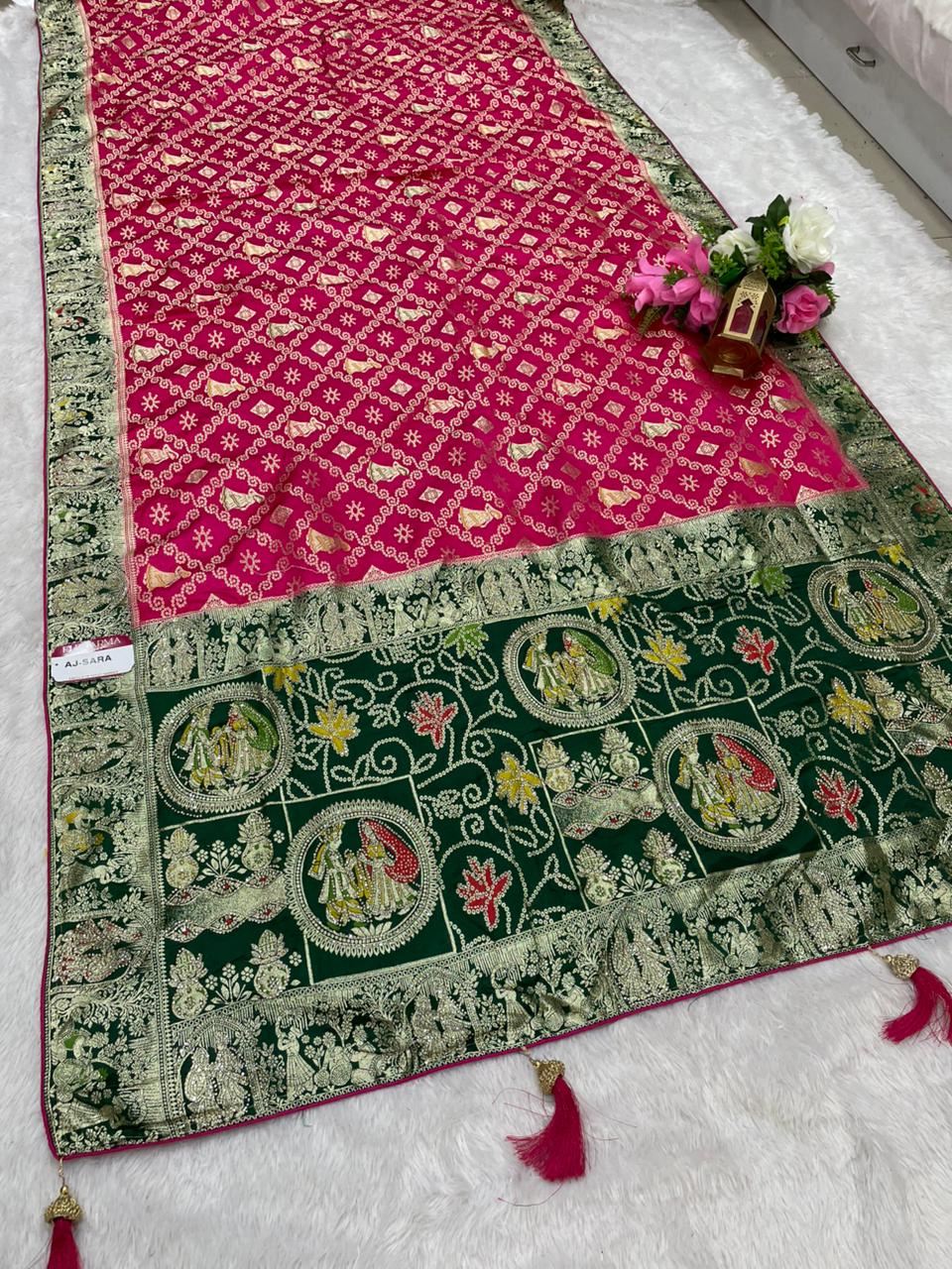 AJ-SARA NAYLON SATIN FABRIC SAREE WITH BEAUTIFUL GHATCOLA DESIGN WITH RICH PALLU DESIGN WITH CHAP HEAVY JARKAN WORK WITH CONTRAST PALLU AND LUXURIOUS TASSELS WITH BUTTI BLOUSE