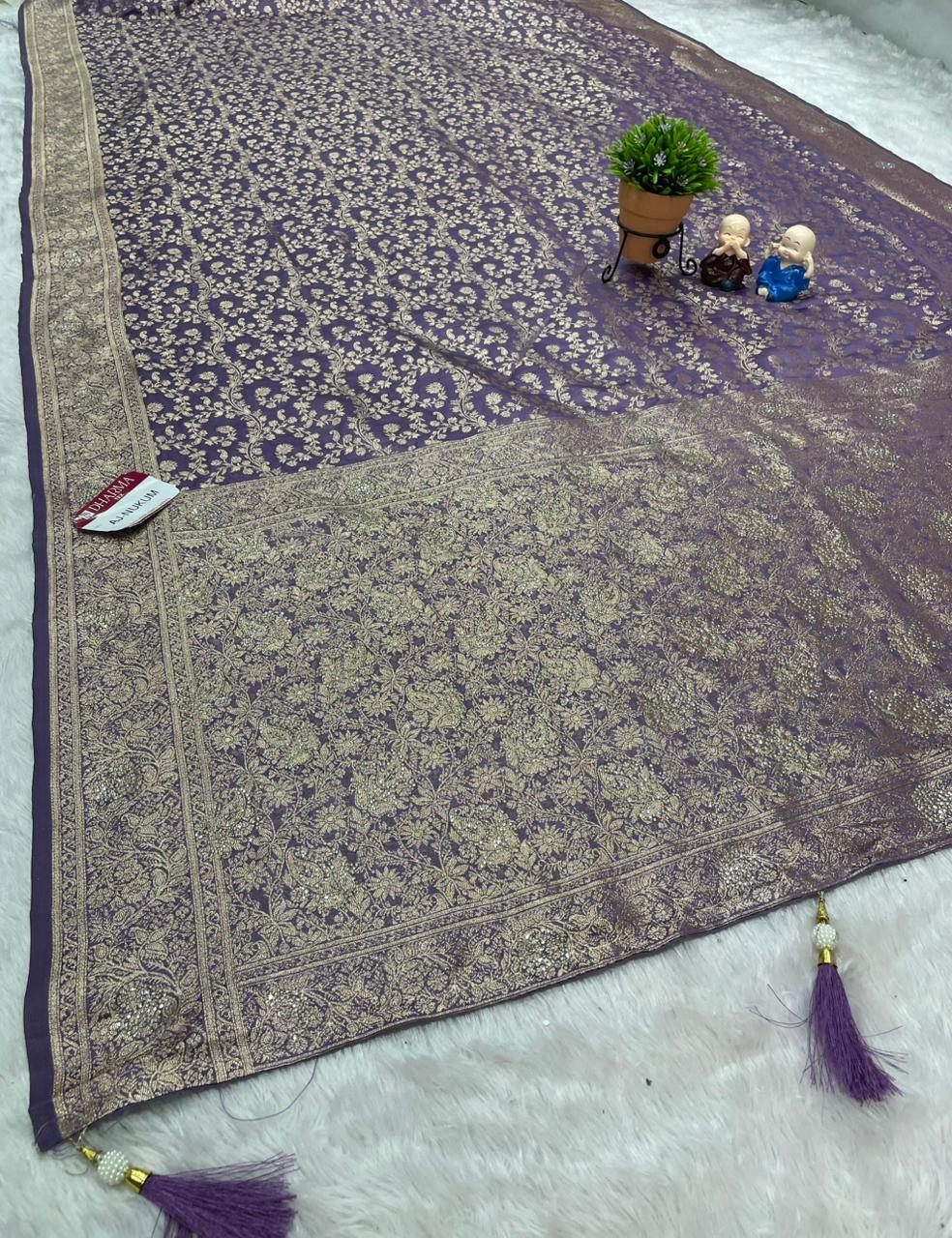 AJ-NUKUM SATIN SILK FABRIC SAREE WITH HEAVY DESIGN WITH HEAVY JARKAN WORKK ALL OVER ON SAREE AND BLOUSE WITH LUXURIOUS TASSELS