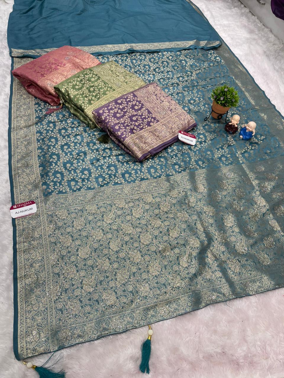 AJ-NUKUM SATIN SILK FABRIC SAREE WITH HEAVY DESIGN WITH HEAVY JARKAN WORKK ALL OVER ON SAREE AND BLOUSE WITH LUXURIOUS TASSELS