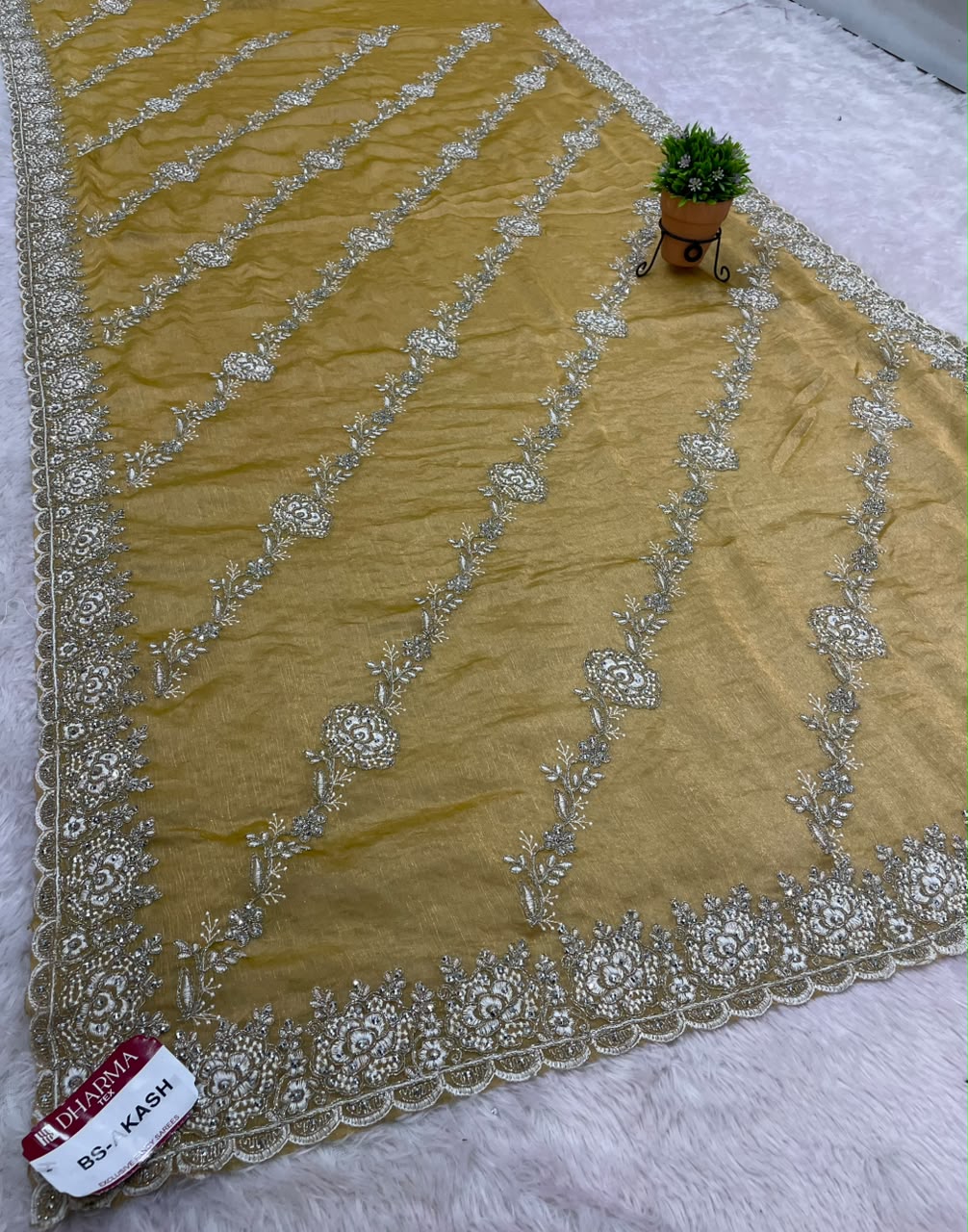 BS-AKASH FANCY FABRIC SAREE WITH HEAVY THREAD EMBROIDERY WITH SEQUENCE AND ELEGANT DIAGONAL FLORAL PATTERN ALL OVER SAREE WITH RICH EMBROIDERED SCALLOP BORDER WITH MATCHING DESIGNER BLOUSE WITH EMBROIDERY WORK