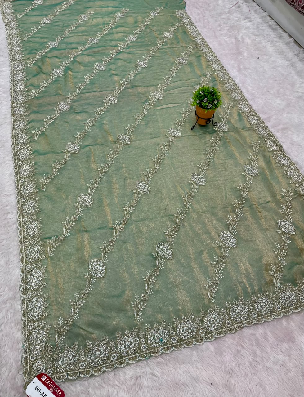 BS-AKASH FANCY FABRIC SAREE WITH HEAVY THREAD EMBROIDERY WITH SEQUENCE AND ELEGANT DIAGONAL FLORAL PATTERN ALL OVER SAREE WITH RICH EMBROIDERED SCALLOP BORDER WITH MATCHING DESIGNER BLOUSE WITH EMBROIDERY WORK