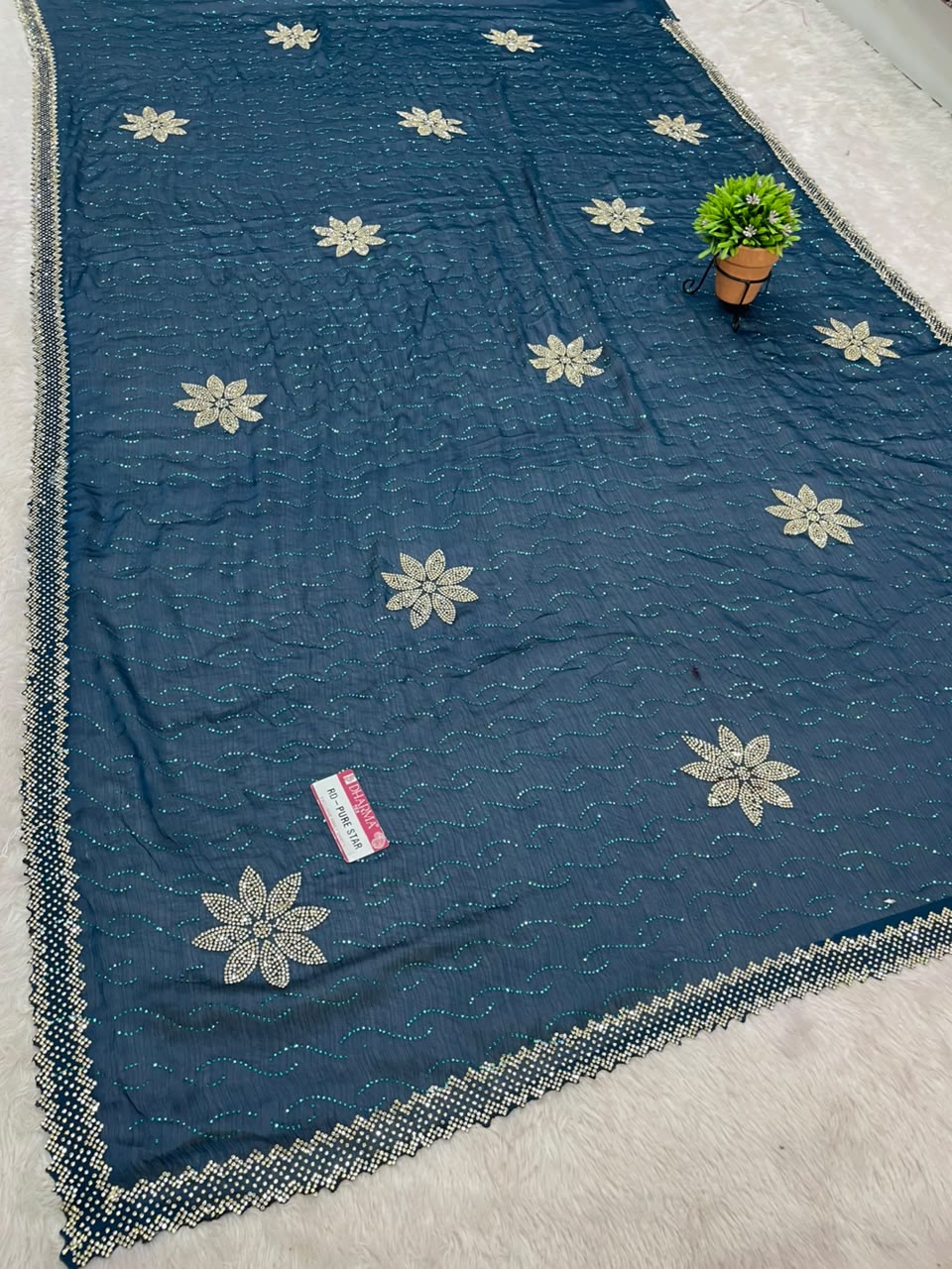 RD-PURE STAR SATIN FABRIC SAREE WITH BEAUTIFUL FLORAL JARKAN & STONE WORK WITH GLITTER HIGHLIGHTS WITH ALL OVER WAVY TEXTURE PATTERN WITH DESIGNER FLOWER BUTTIS AND MATCHING DESIGNER BLOUSE WITH NECK WORK