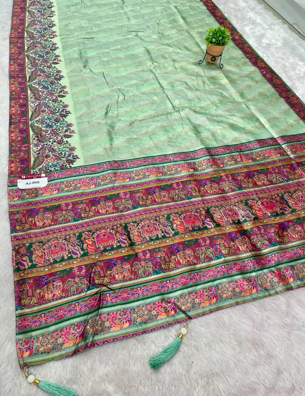 AJ-IRIS FANCY FABRIC SAREE WITH BEAUTIFUL PRINT  WITH DMC SIROSKI WORK WITH MEENAKARI WORK WITH BEAUTIFUL PEACOCK AND GAJRAJ DESIGN WITH PIPING AND LATKAN WITH BLOUSE