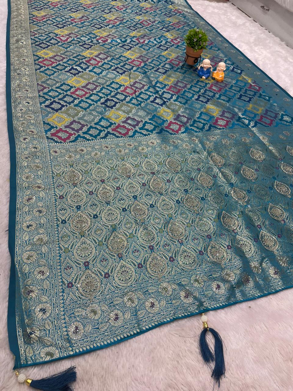 AJ-MOKSHA SATIN SILK FABRIC SAREE WITH RICH PALLU DESIGN WITH HEAVY JARKAN WORK WITH PANGKAT DESIGN ON BODY WITH TASSELS AND BLOUSE