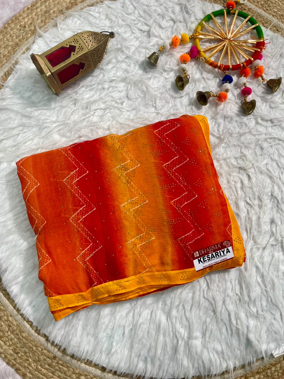 KESARIYA-CATLOGUE WEIGHTLESS FABRIC SAREE WITH BEAUTIFUL LEHARIYA DESIGN WITH DMC SIROSKI WORK ALL OVER ON SAREE WITH BLOUSE