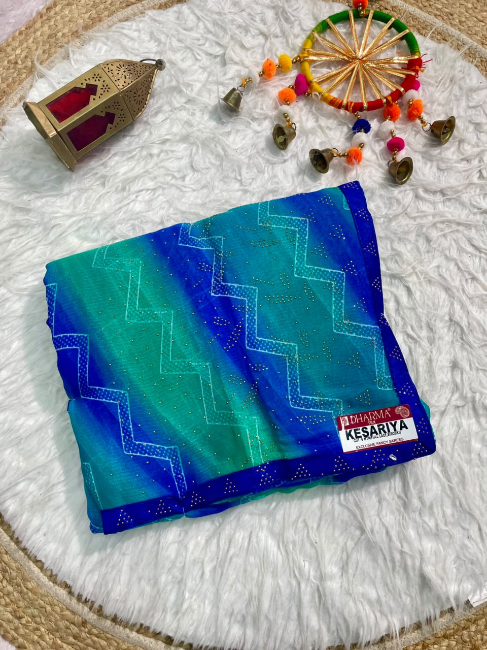 KESARIYA-CATLOGUE WEIGHTLESS FABRIC SAREE WITH BEAUTIFUL LEHARIYA DESIGN WITH DMC SIROSKI WORK ALL OVER ON SAREE WITH BLOUSE