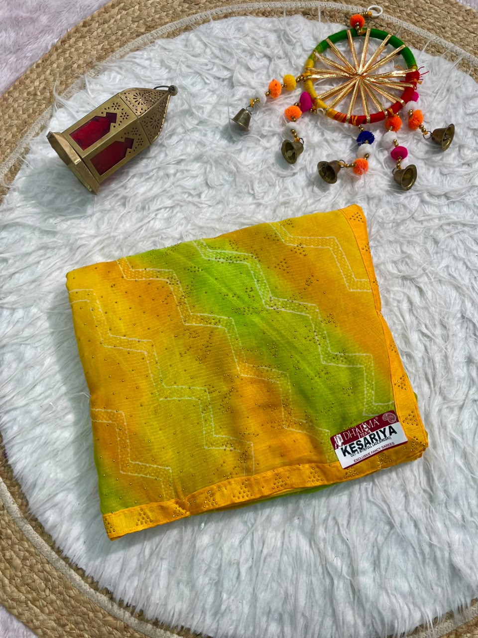 KESARIYA-CATLOGUE WEIGHTLESS FABRIC SAREE WITH BEAUTIFUL LEHARIYA DESIGN WITH DMC SIROSKI WORK ALL OVER ON SAREE WITH BLOUSE