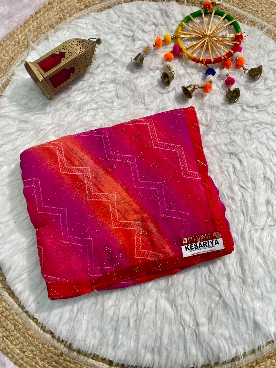 KESARIYA-CATLOGUE WEIGHTLESS FABRIC SAREE WITH BEAUTIFUL LEHARIYA DESIGN WITH DMC SIROSKI WORK ALL OVER ON SAREE WITH BLOUSE