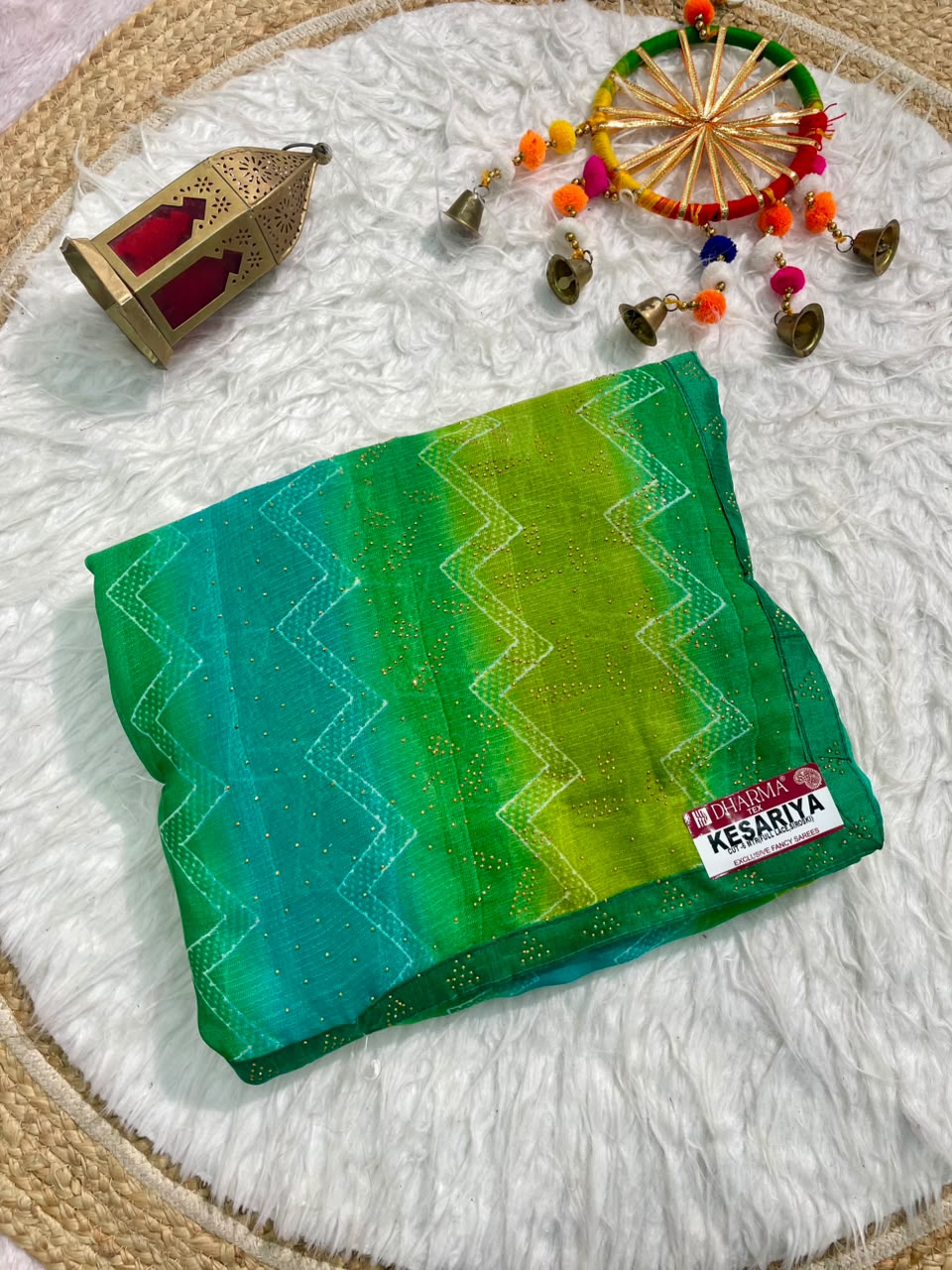 KESARIYA-CATLOGUE WEIGHTLESS FABRIC SAREE WITH BEAUTIFUL LEHARIYA DESIGN WITH DMC SIROSKI WORK ALL OVER ON SAREE WITH BLOUSE