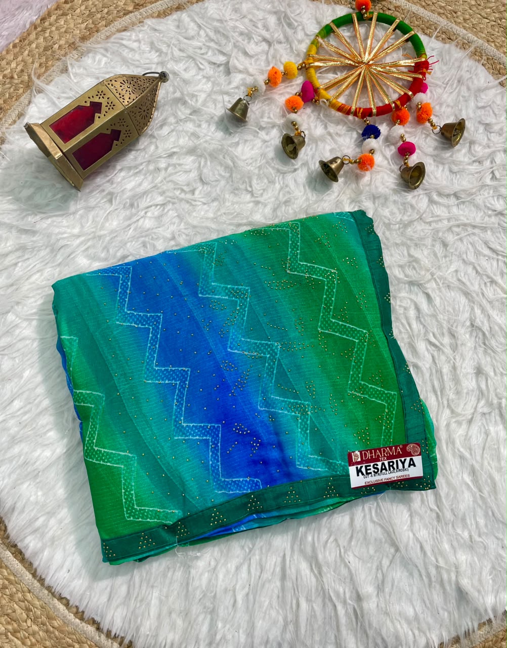 KESARIYA-CATLOGUE WEIGHTLESS FABRIC SAREE WITH BEAUTIFUL LEHARIYA DESIGN WITH DMC SIROSKI WORK ALL OVER ON SAREE WITH BLOUSE