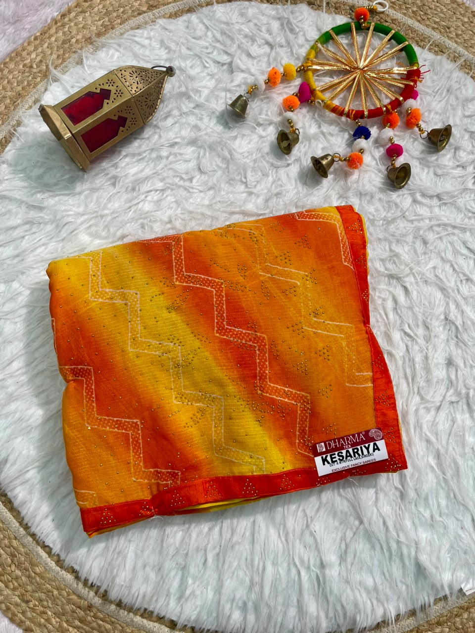 KESARIYA-CATLOGUE WEIGHTLESS FABRIC SAREE WITH BEAUTIFUL LEHARIYA DESIGN WITH DMC SIROSKI WORK ALL OVER ON SAREE WITH BLOUSE