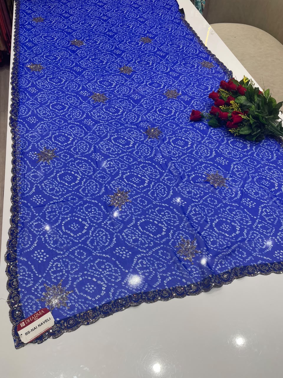 BS-NAI NAVELI BANDHANI FABRIC SAREE WITH HEAVY DMC SIROSKI WORK ALL OVER ON SAREE WITH BEAUTIFUL BANDHANI DESIGN ON SAREE WITH BLOUSE