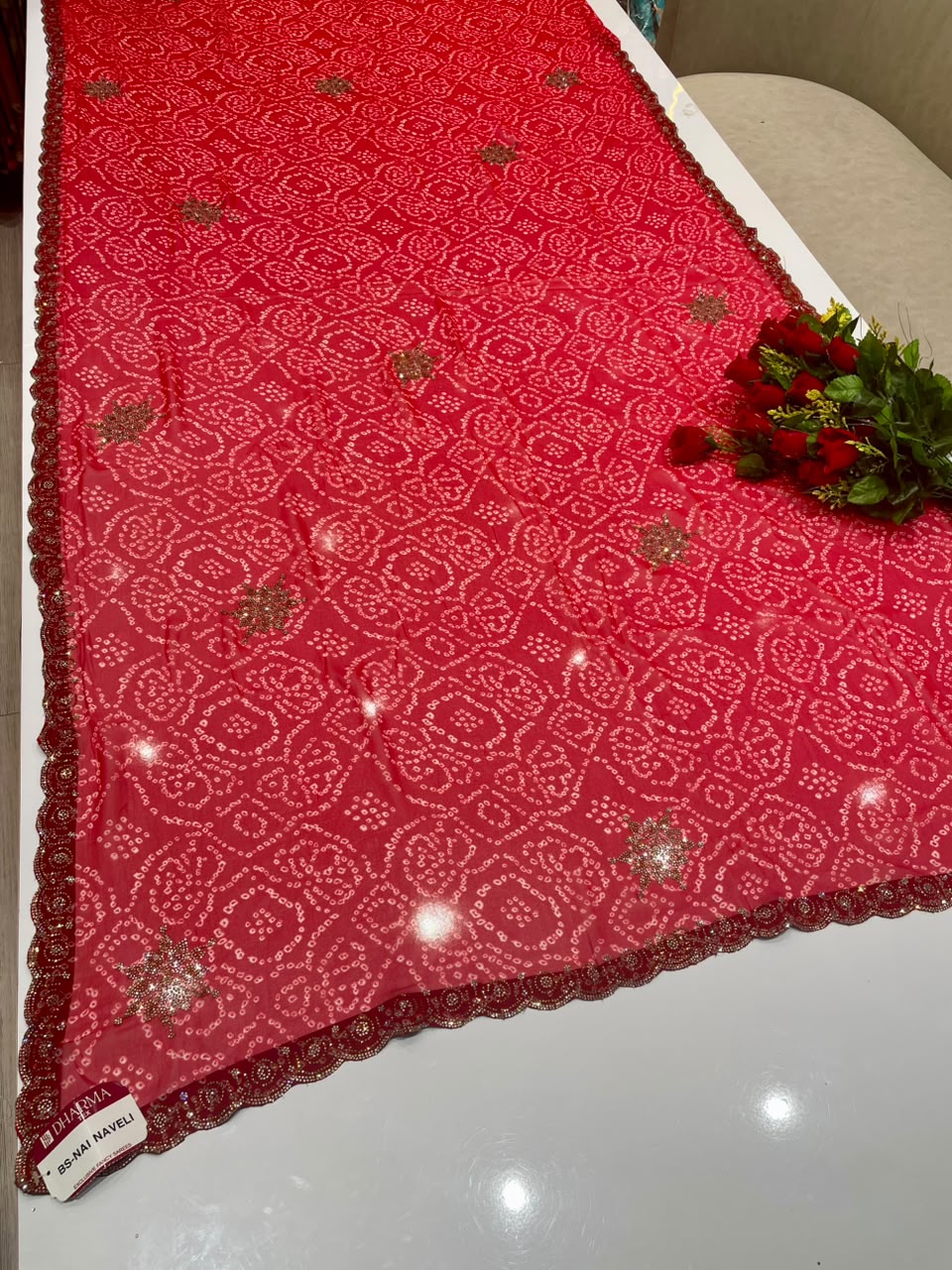 BS-NAI NAVELI BANDHANI FABRIC SAREE WITH HEAVY DMC SIROSKI WORK ALL OVER ON SAREE WITH BEAUTIFUL BANDHANI DESIGN ON SAREE WITH BLOUSE