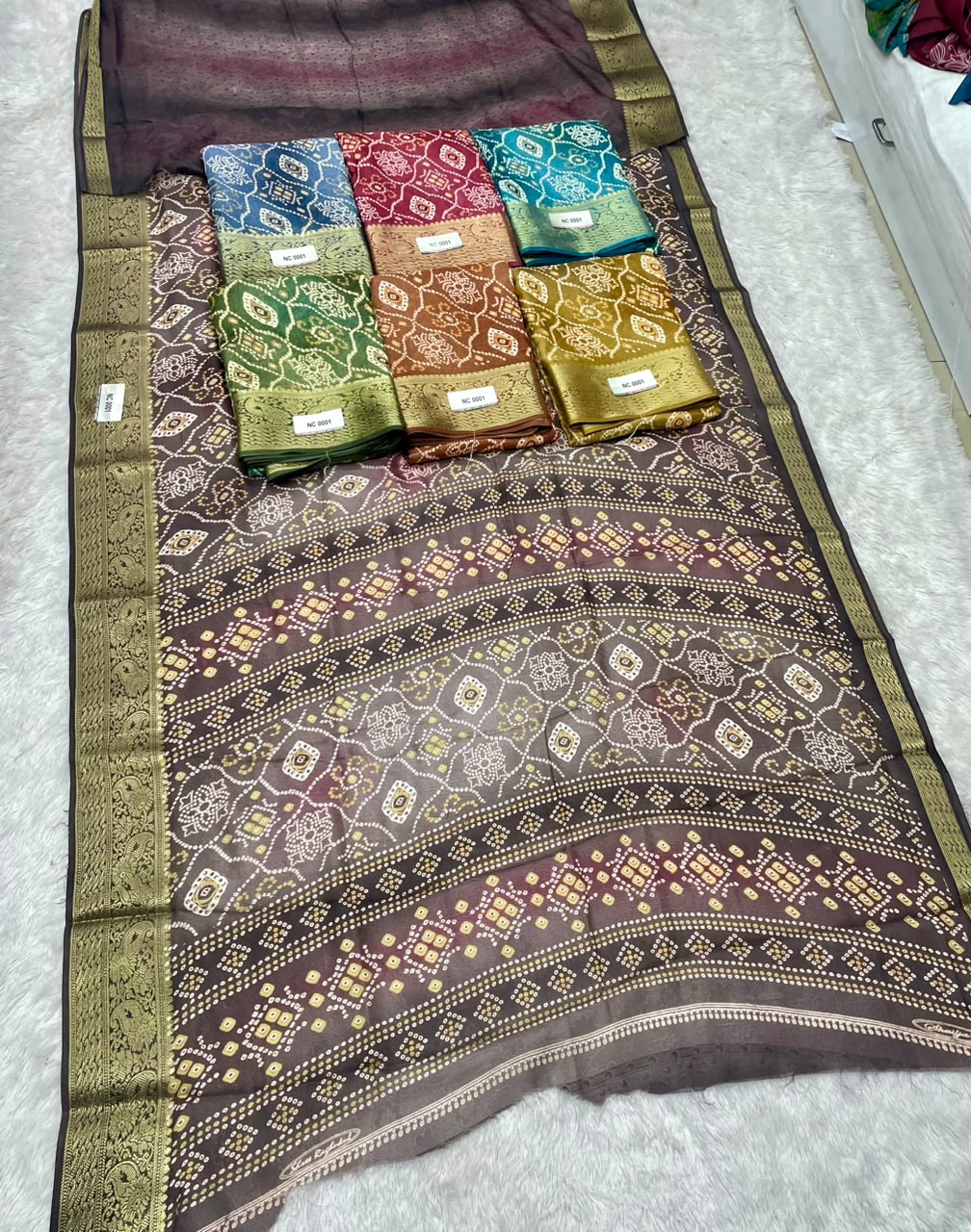 NC-0001  MARSHMALLOW PADDING FABRIC SAREE WITH WITH BEAUTIFUL FLORAL DESIGN ALL OVER ON SAREE WITH JACAURD BORDER WITH BLOUSE