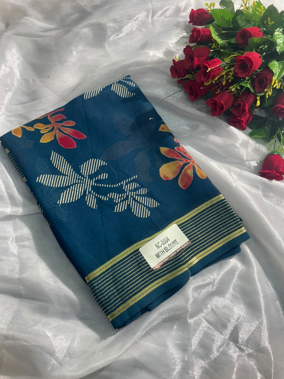 NC-0004  DULL MOSS FABRIC SAREE WITH RICH PALLU DESIGN WITH BEAUTIFUL RADHIKA BORDER WITH FLORAL DESIGN ON BODY WITH BLOUSE