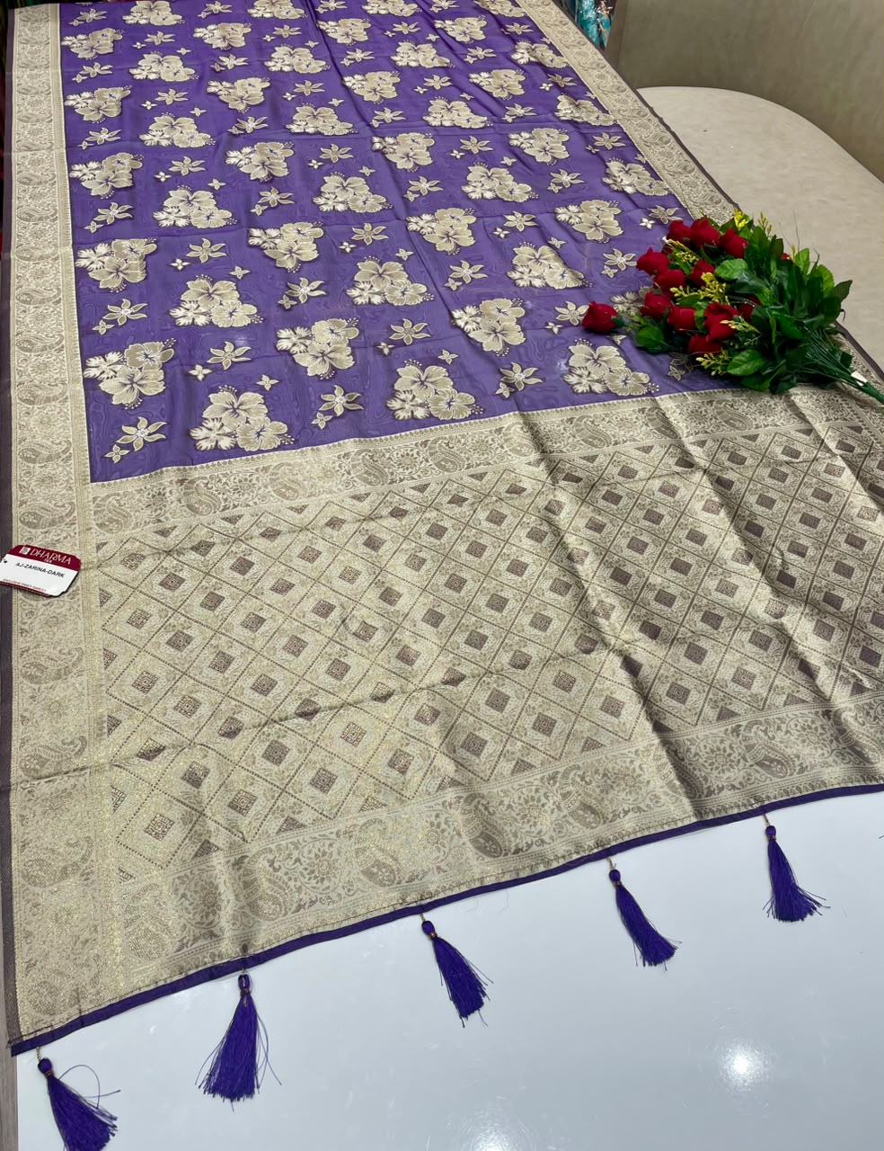 AJ-ZARINA-DARK  FANCY FABRIC SAREE WITH HEAVY RICH PALLU DESIGN WITH FLORAL DESIGN ALL OVER ON BODY WITH PIPING AND TASSELS WITH BLOUSE
