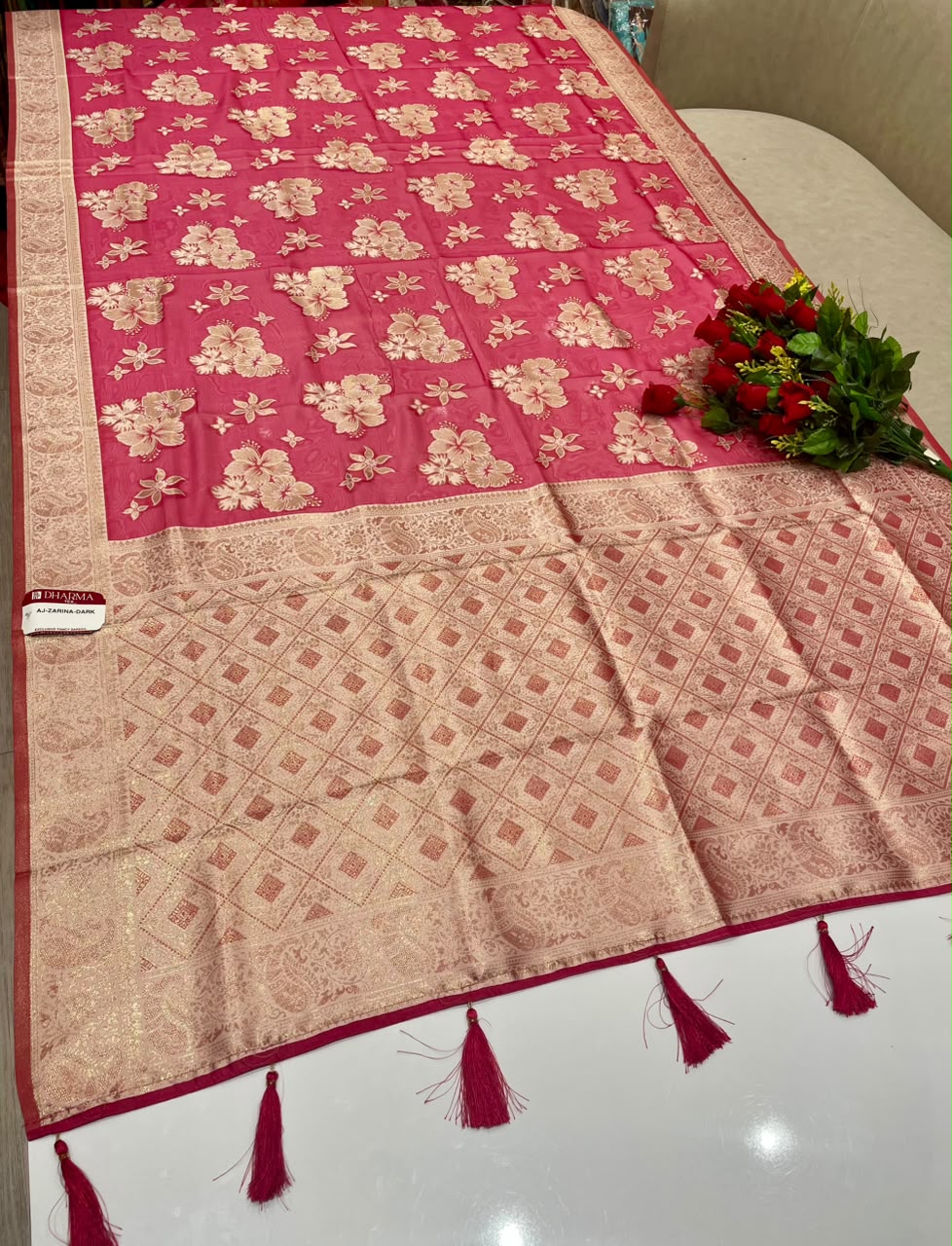 AJ-ZARINA-DARK  FANCY FABRIC SAREE WITH HEAVY RICH PALLU DESIGN WITH FLORAL DESIGN ALL OVER ON BODY WITH PIPING AND TASSELS WITH BLOUSE