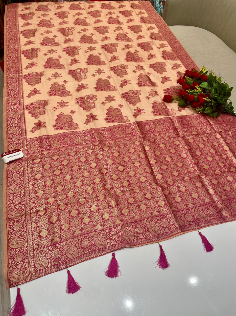 AJ-ZARINA-LIGHT FANCY FABRIC SAREE WITH HEAVY RICH PALLU DESIGN WITH FLORAL DESIGN ALL OVER ON BODY WITH PIPING AND TASSELS WITH BLOUSE