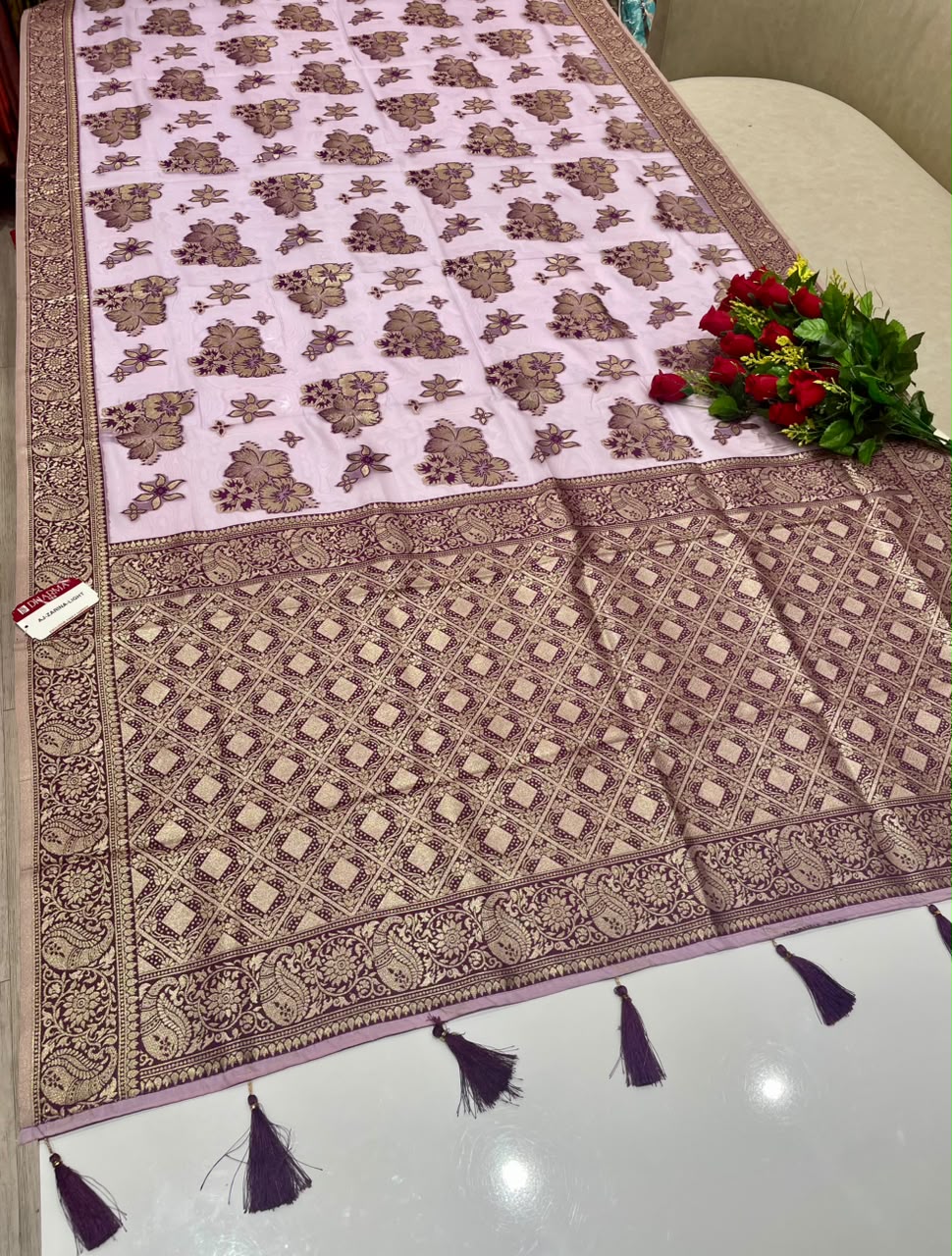 AJ-ZARINA-LIGHT FANCY FABRIC SAREE WITH HEAVY RICH PALLU DESIGN WITH FLORAL DESIGN ALL OVER ON BODY WITH PIPING AND TASSELS WITH BLOUSE