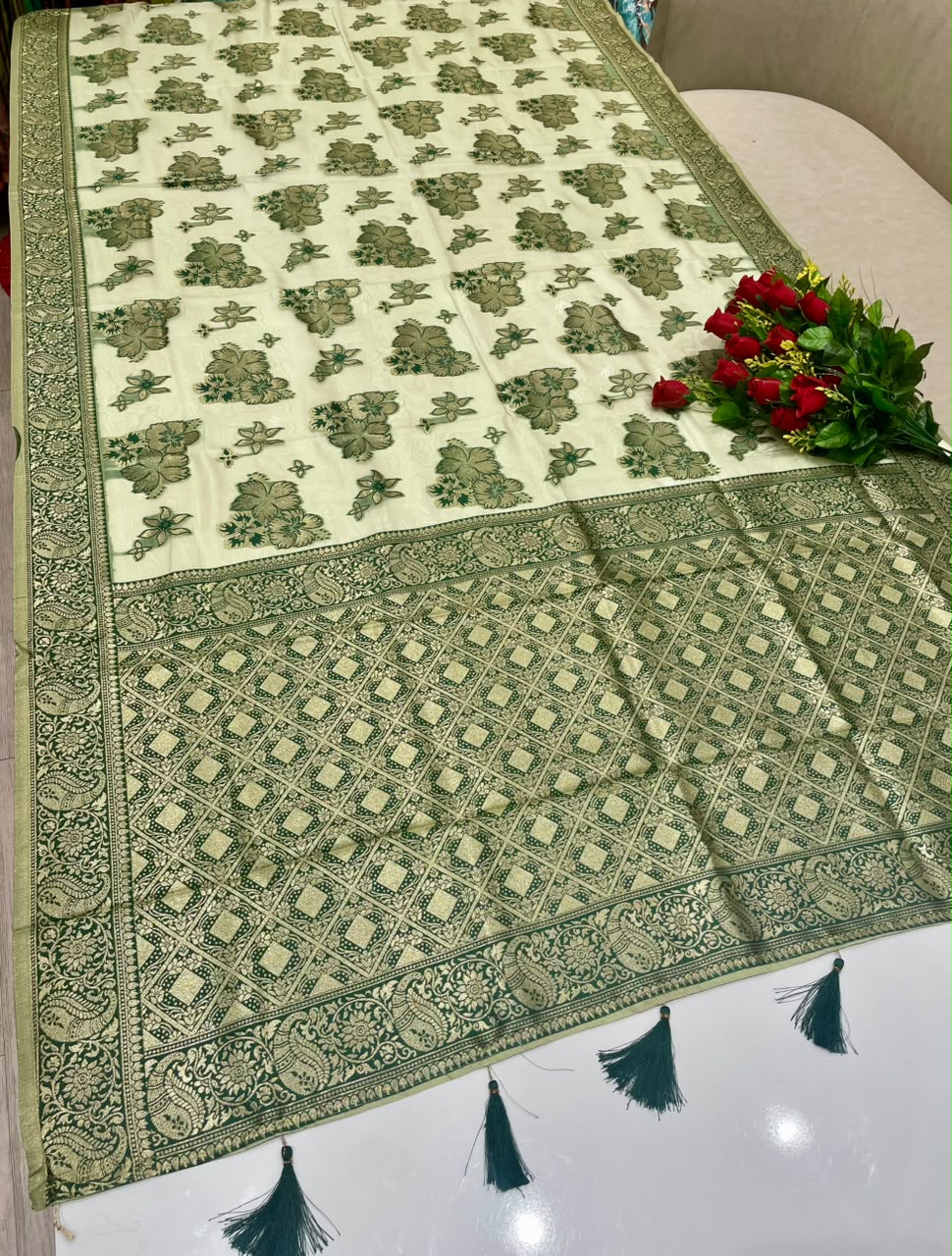 AJ-ZARINA-LIGHT FANCY FABRIC SAREE WITH HEAVY RICH PALLU DESIGN WITH FLORAL DESIGN ALL OVER ON BODY WITH PIPING AND TASSELS WITH BLOUSE