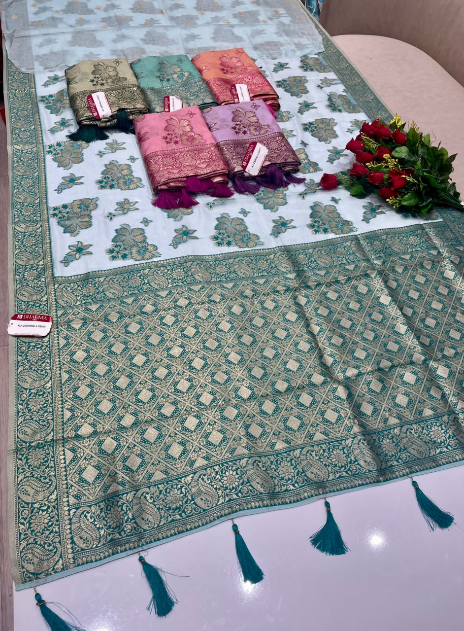 AJ-ZARINA-LIGHT FANCY FABRIC SAREE WITH HEAVY RICH PALLU DESIGN WITH FLORAL DESIGN ALL OVER ON BODY WITH PIPING AND TASSELS WITH BLOUSE