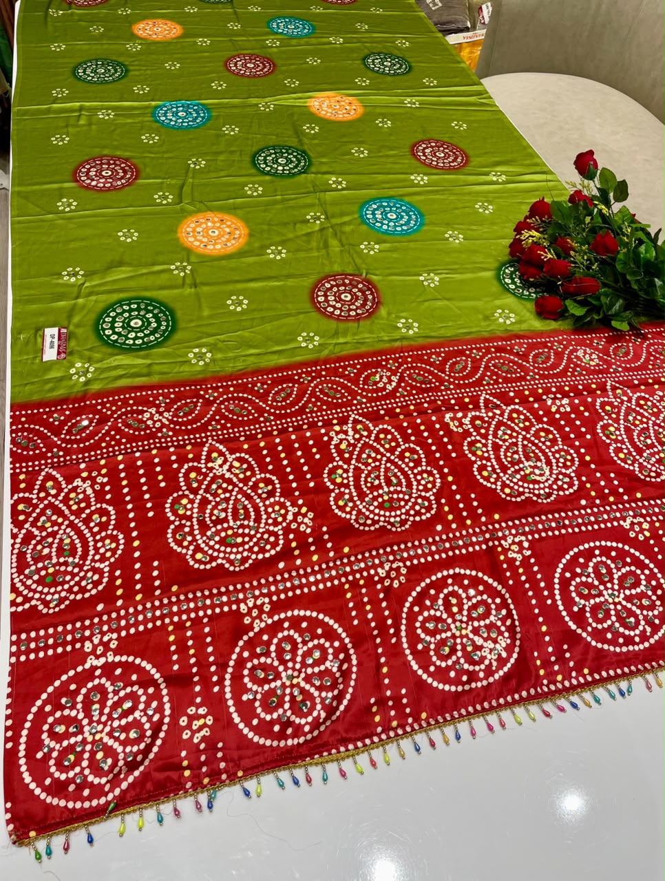 DP-4096 JAPAN SATIN FABRIC SAREE WITH BEAUTIFUL DESIGN WITH HEAVY MIRROR WORK ON SAREE WITH BANDHANI DESIGN WITH HEAVY TASSELS WITH BLOUSE