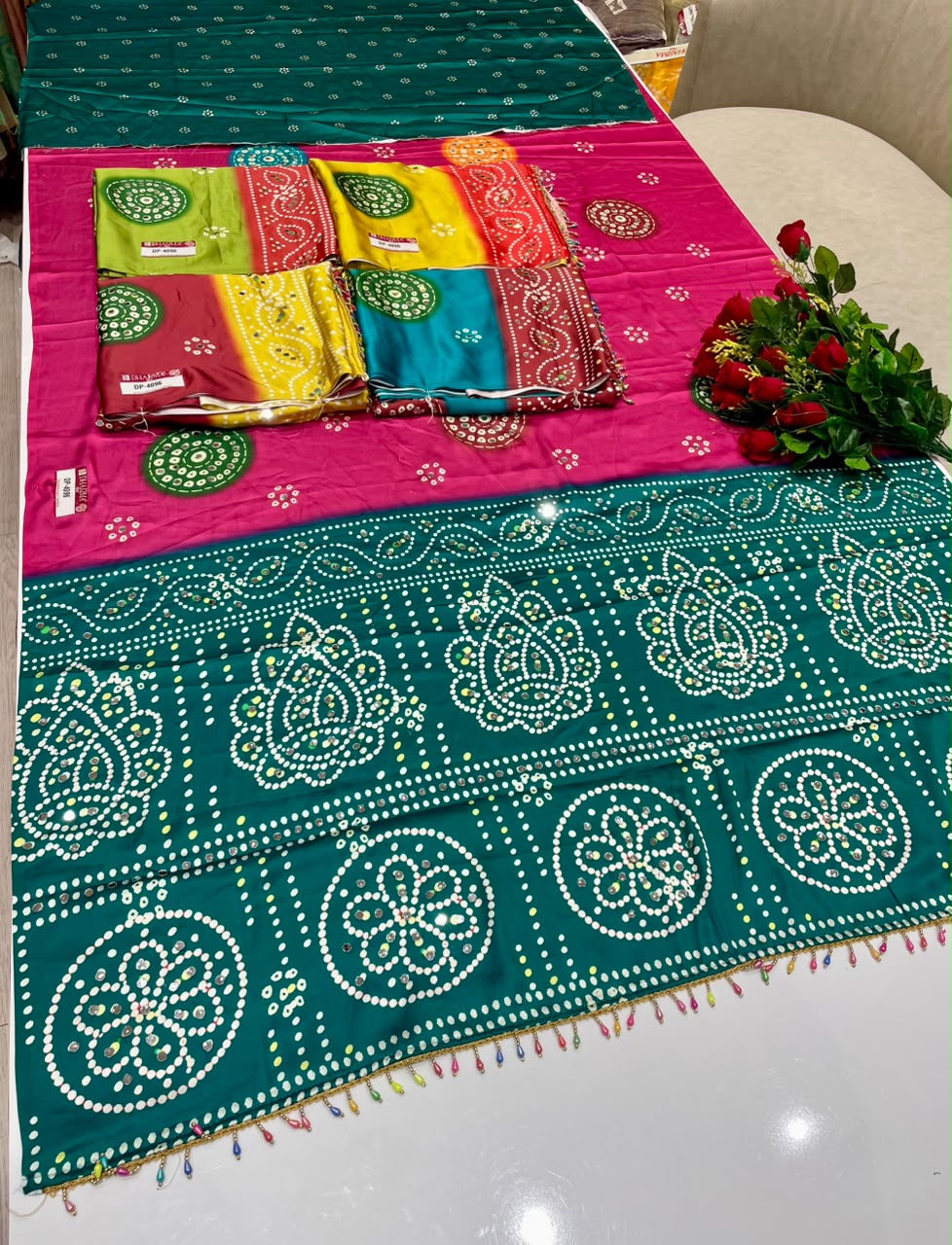 DP-4096 JAPAN SATIN FABRIC SAREE WITH BEAUTIFUL DESIGN WITH HEAVY MIRROR WORK ON SAREE WITH BANDHANI DESIGN WITH HEAVY TASSELS WITH BLOUSE