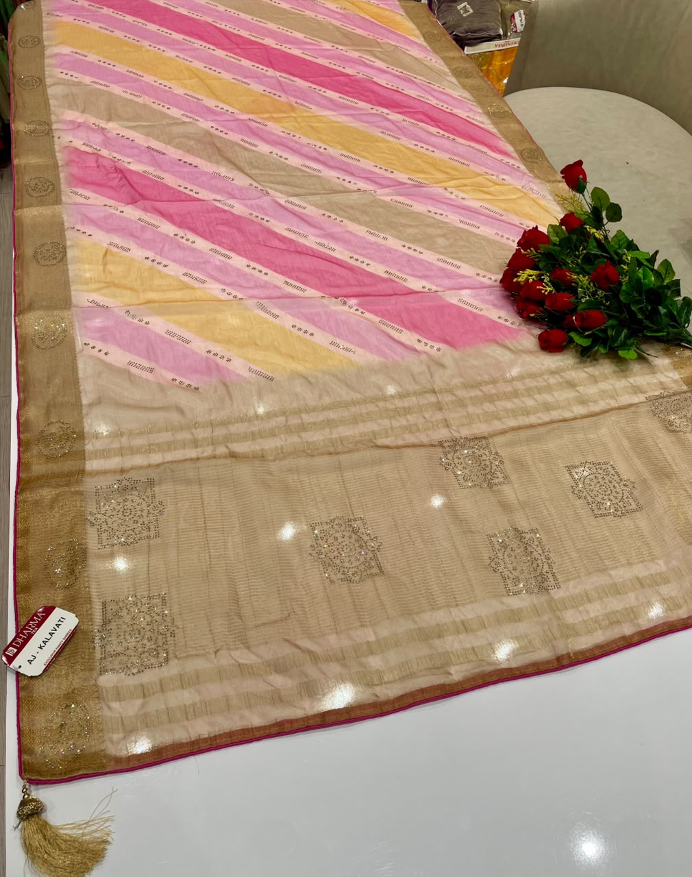 AJ-KALAVATI FANCY FABRIC SAREE WITH BEAUTIFUL SIROSKI WORK ON PALLU WITH LOVELY LAHARIYA DESIGN WITH BLOUSE