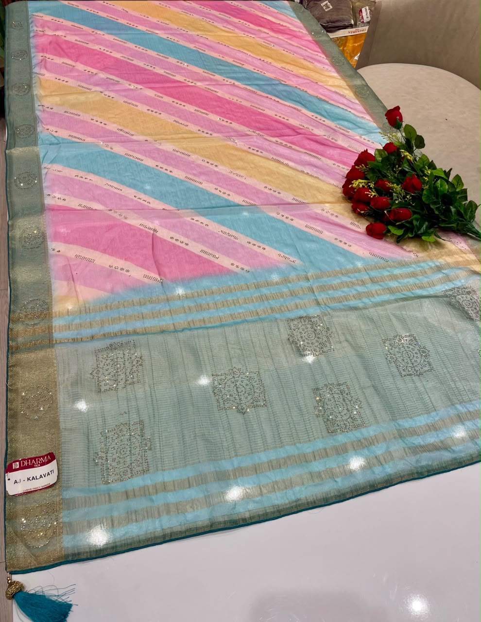 AJ-KALAVATI FANCY FABRIC SAREE WITH BEAUTIFUL SIROSKI WORK ON PALLU WITH LOVELY LAHARIYA DESIGN WITH BLOUSE