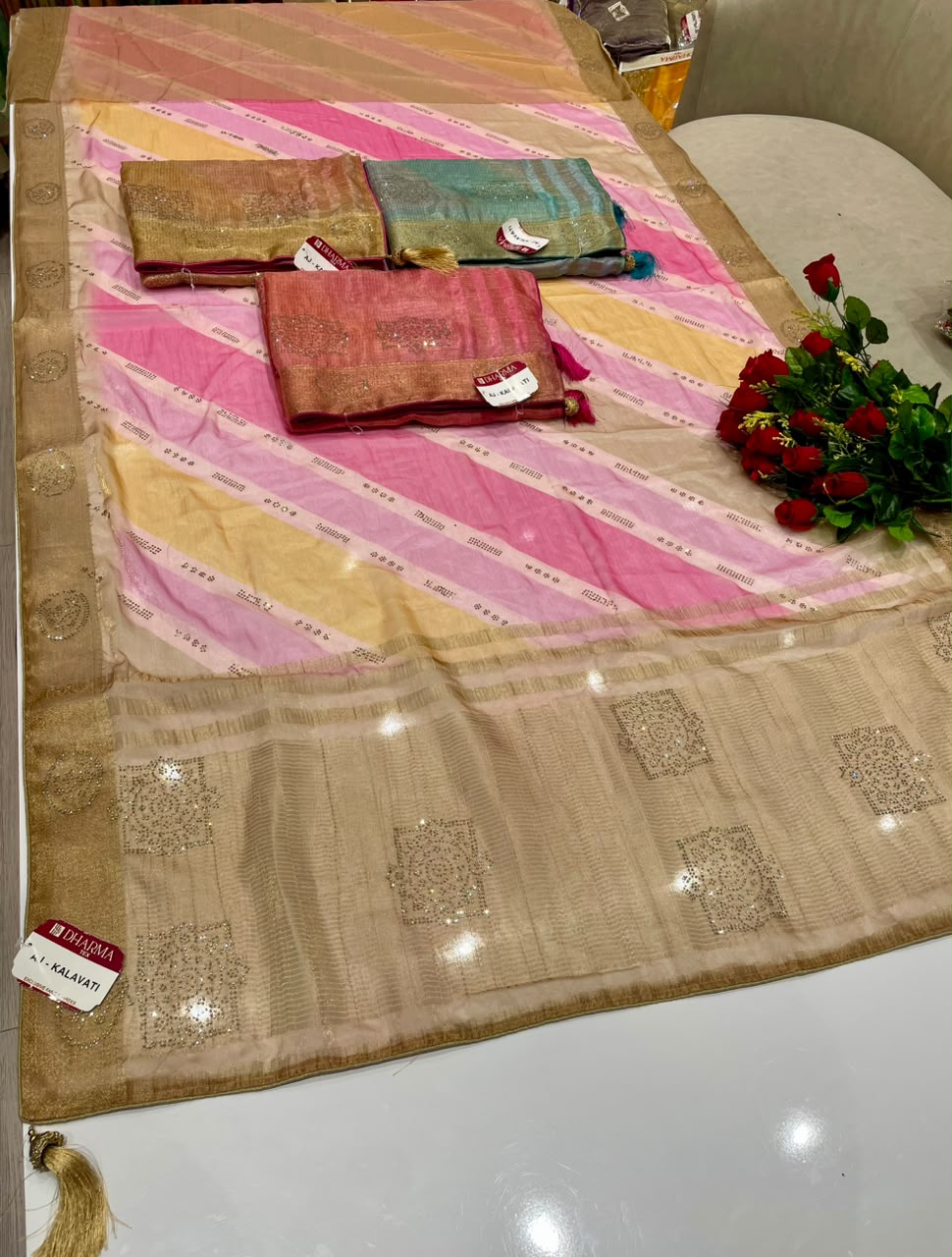AJ-KALAVATI FANCY FABRIC SAREE WITH BEAUTIFUL SIROSKI WORK ON PALLU WITH LOVELY LAHARIYA DESIGN WITH BLOUSE