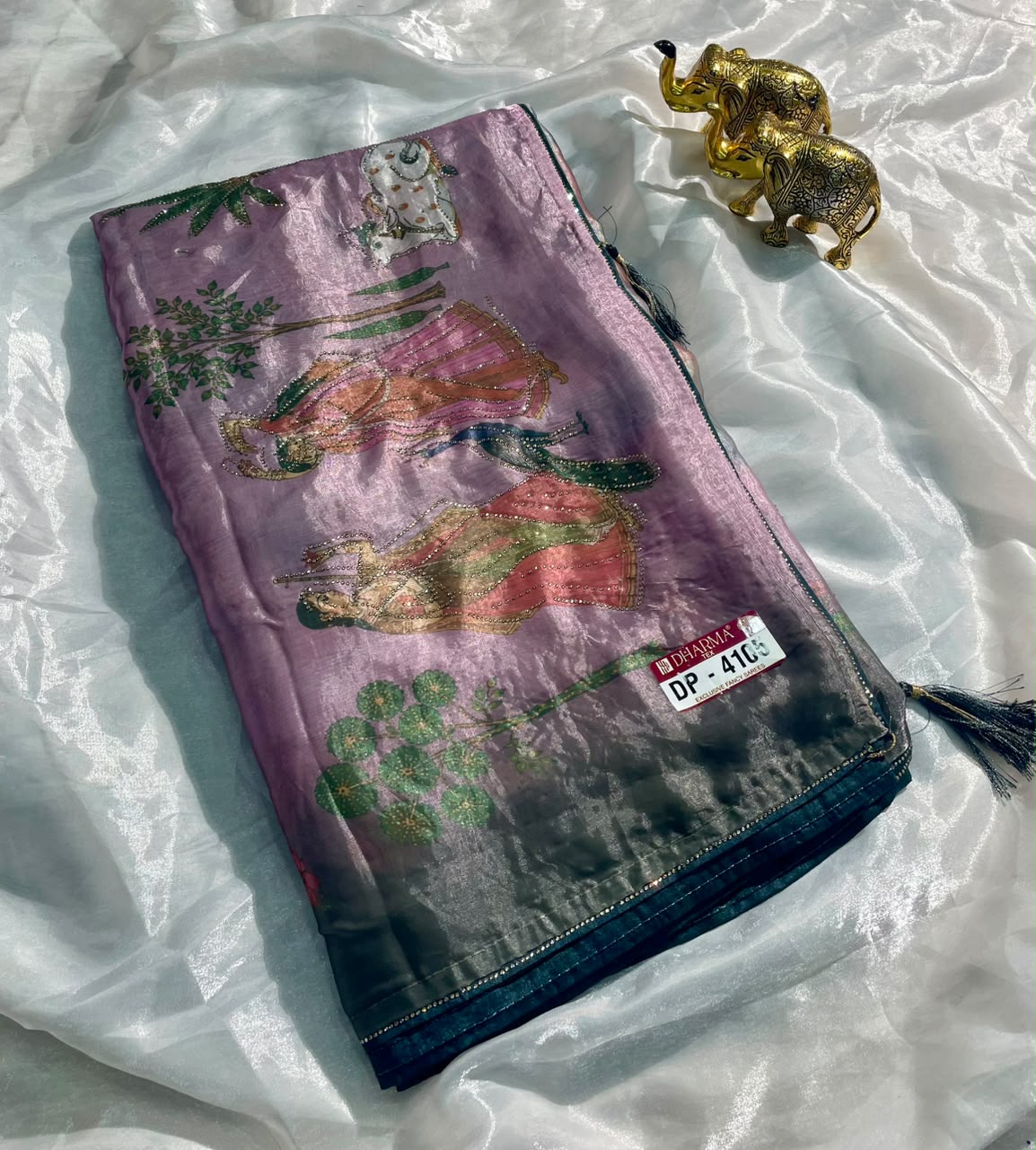 DP-4105 FENDI SATIN FABRIC SAREE WITH BEAUTIFUL DESIGN WITH COW AND OTHER BEAUTIFUL PRINT WITH DMC SIROSKI WORK WITH PIPING AND TASSELS WITH BLOUSE