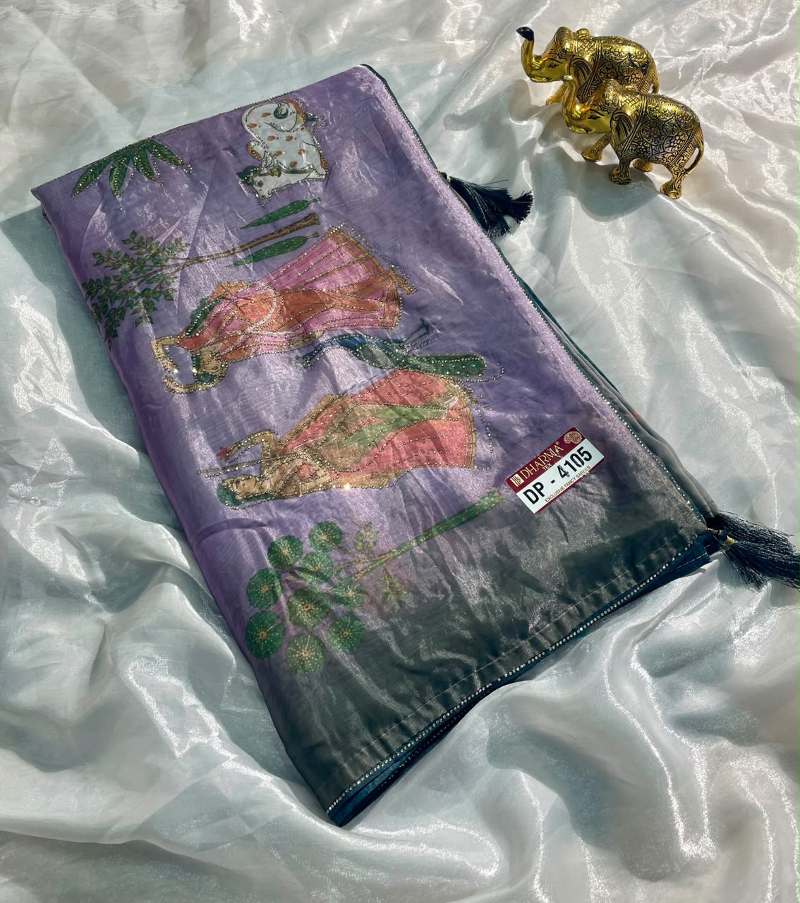 DP-4105 FENDI SATIN FABRIC SAREE WITH BEAUTIFUL DESIGN WITH COW AND OTHER BEAUTIFUL PRINT WITH DMC SIROSKI WORK WITH PIPING AND TASSELS WITH BLOUSE