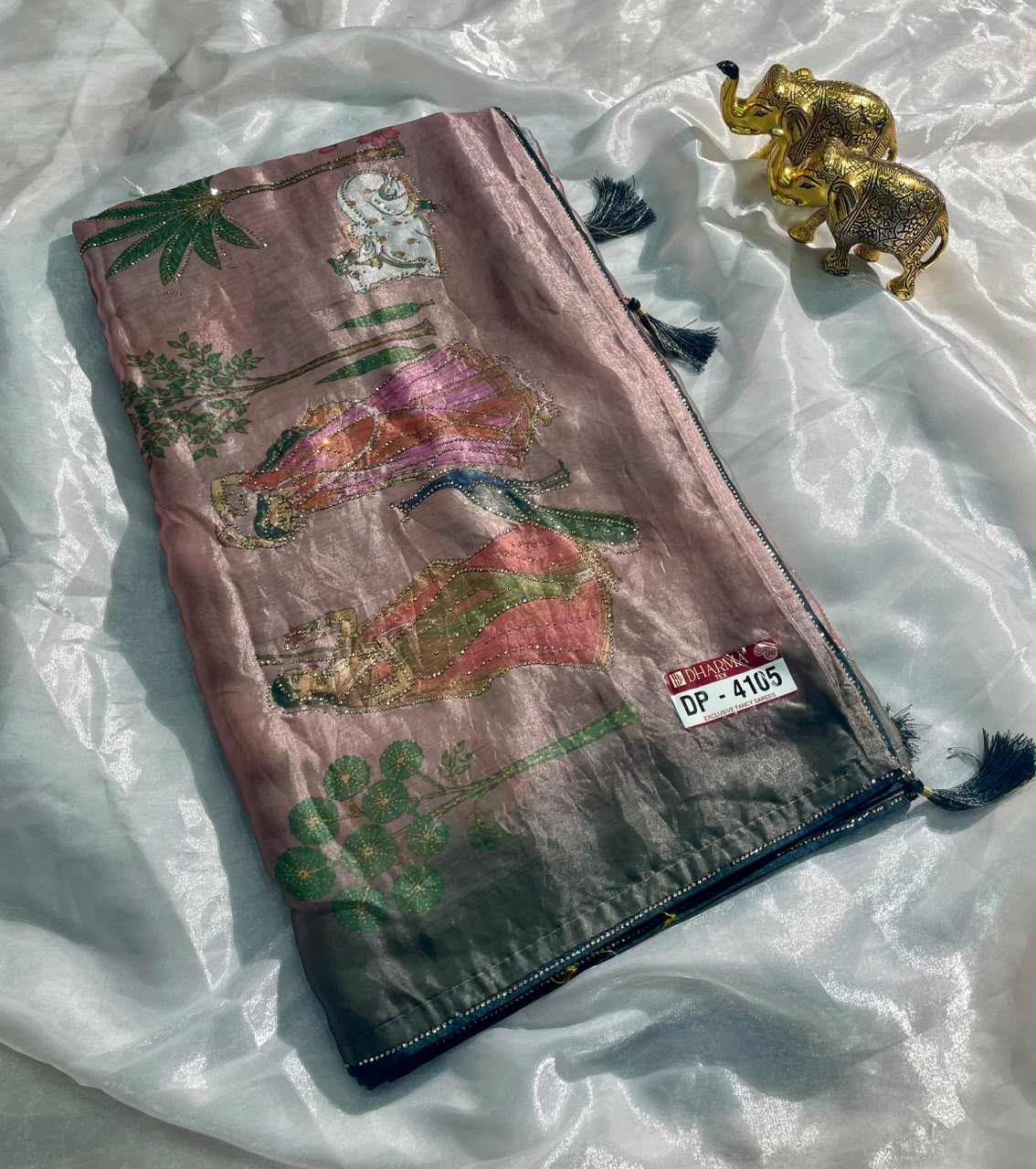 DP-4105 FENDI SATIN FABRIC SAREE WITH BEAUTIFUL DESIGN WITH COW AND OTHER BEAUTIFUL PRINT WITH DMC SIROSKI WORK WITH PIPING AND TASSELS WITH BLOUSE