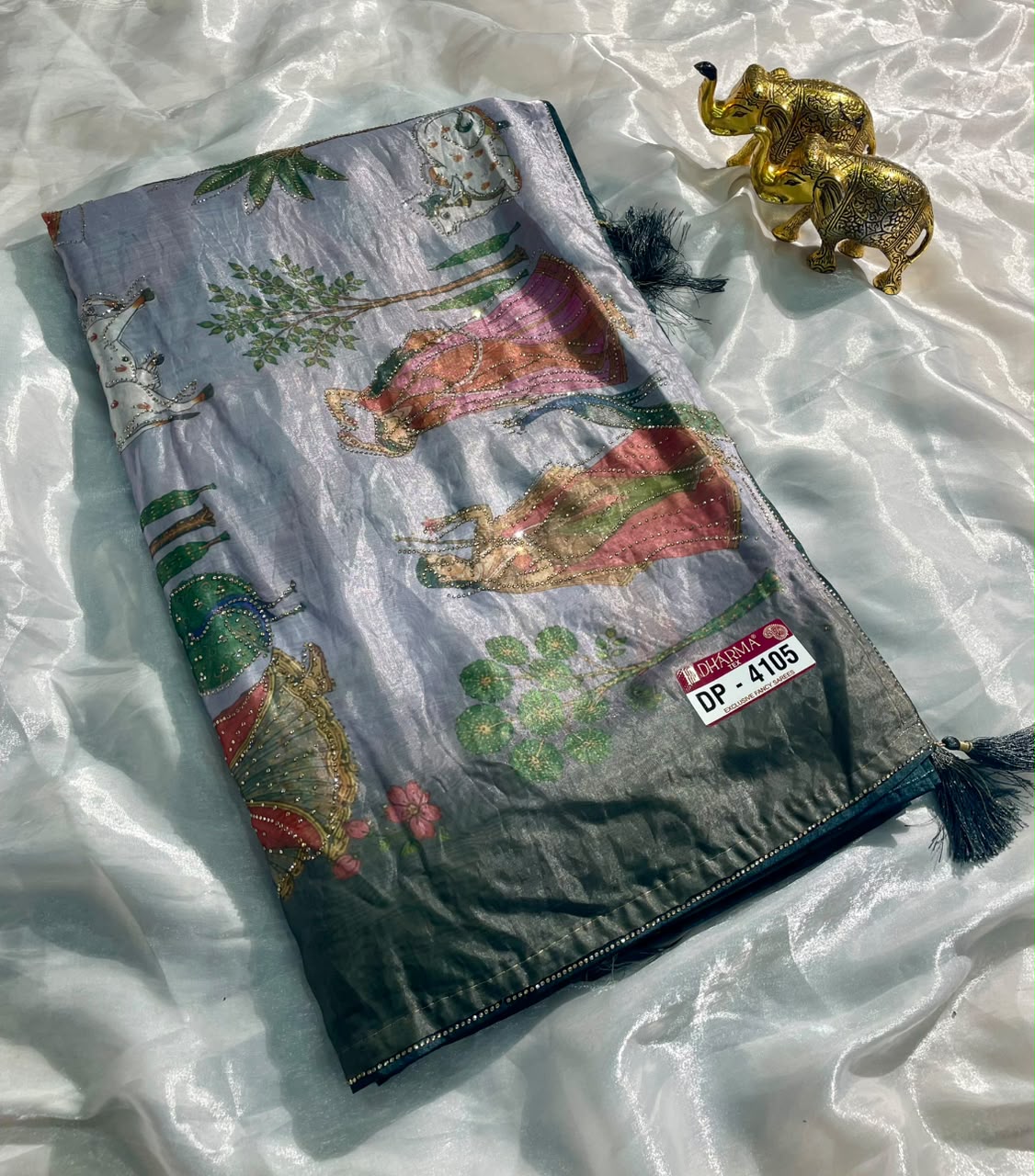 DP-4105 FENDI SATIN FABRIC SAREE WITH BEAUTIFUL DESIGN WITH COW AND OTHER BEAUTIFUL PRINT WITH DMC SIROSKI WORK WITH PIPING AND TASSELS WITH BLOUSE