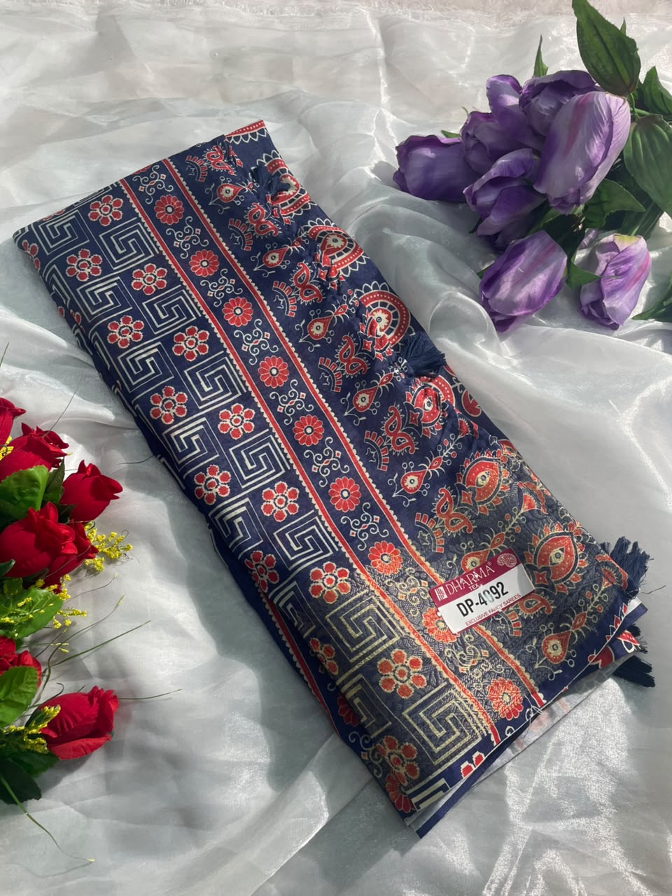 DP-4092 FANCY FABRIC SAREE WITH BEAUTIFUL HEAVY DESIGN WITH RICH PALLU WITH CARRY DESIGN ON SAREE WITH BLOUSE