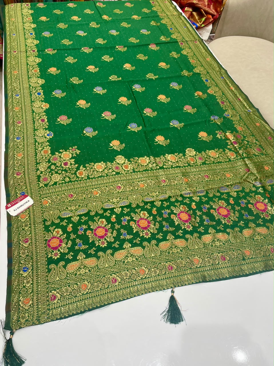 AJ-DHRUVIKA CHAMPION SILK FABRIC SAREE WITH RICH PALLU DESIGN WITH MEENAKARI WORK WITH FLORAL DESIGN WITH BORDER WITH PIPING AND TASSELS WITH BLOUSE